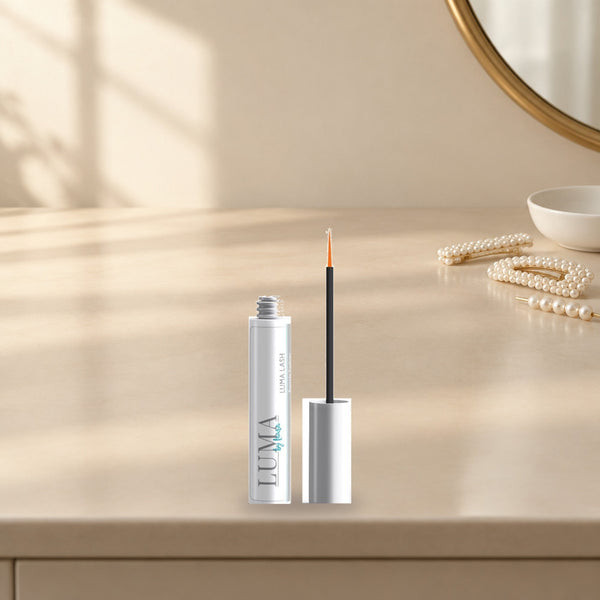 Luma Lash serum tube in a bright bathroom setting